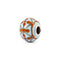 Decorative bead with floral pattern on a white background