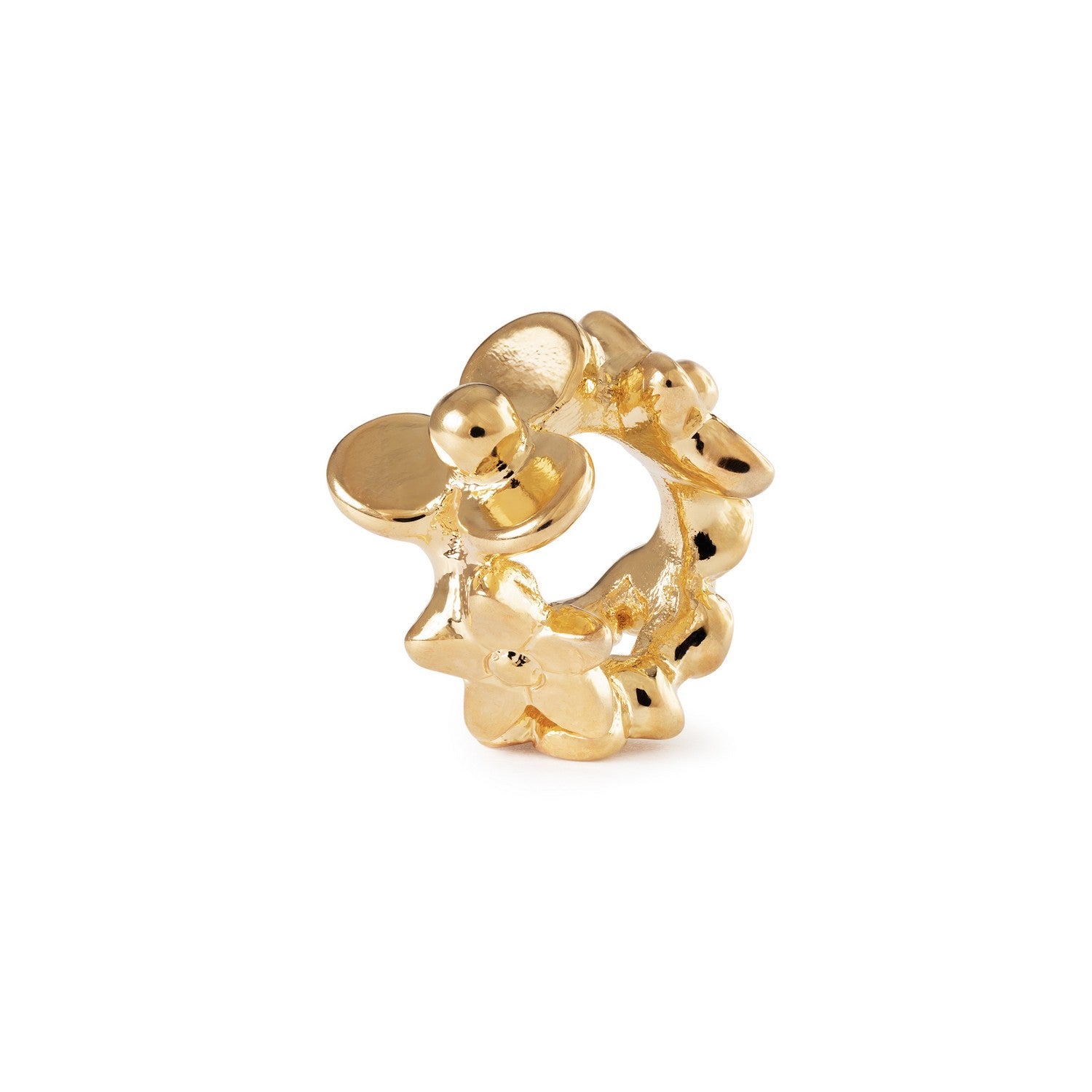 Gold flower-shaped earring on a white background