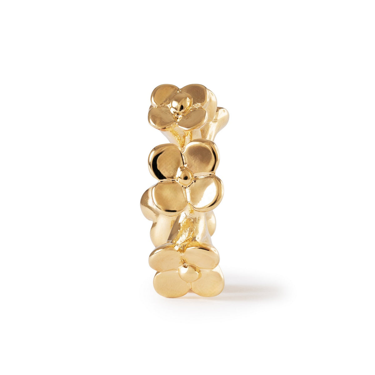 Gold floral earring on a white background