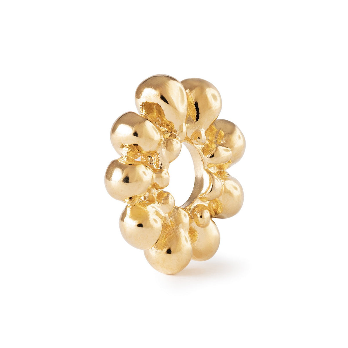 Gold decorative ring with a white background