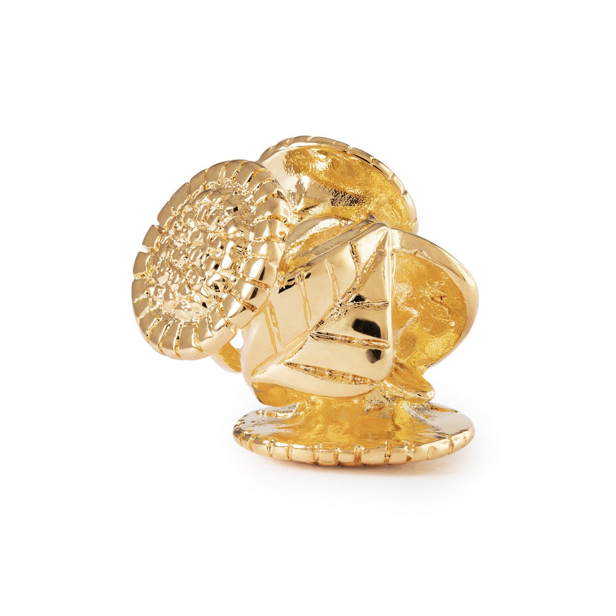 Gold ring with intricate design on a white background