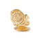 Gold ring with intricate design on a white background