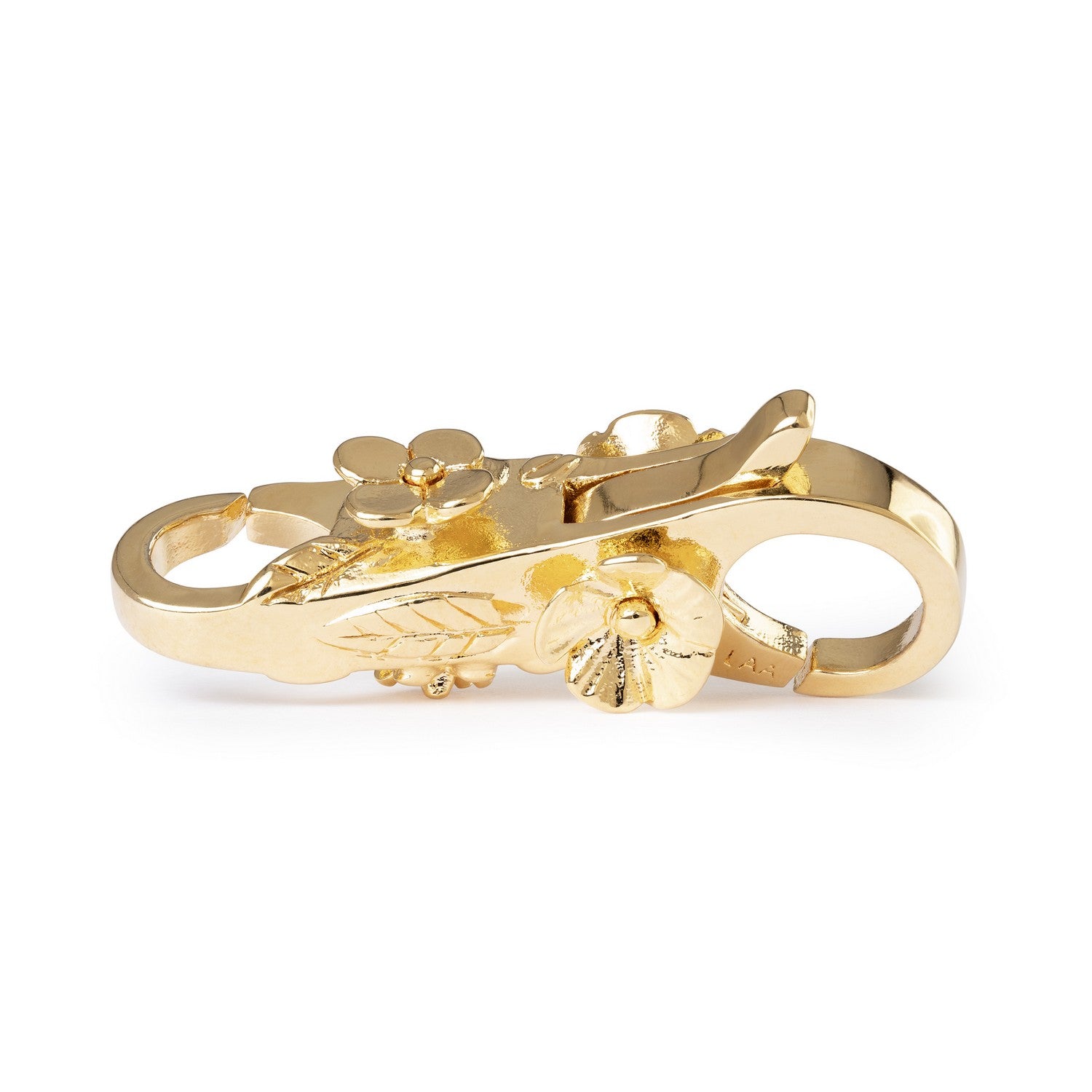 Gold clasp with floral design on a white background