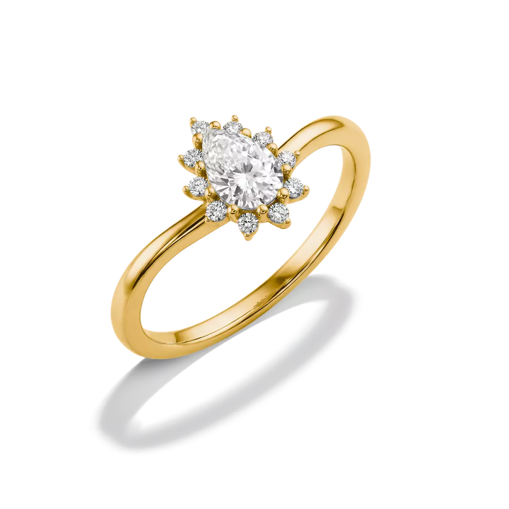A yellow gold ring with a marquise-cut center stone and smaller surrounding stones, shown on a clean white background with a soft shadow.