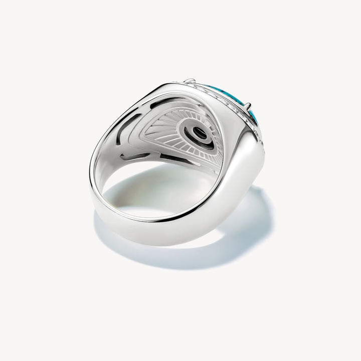 Silver ring with a blue gemstone on a white background