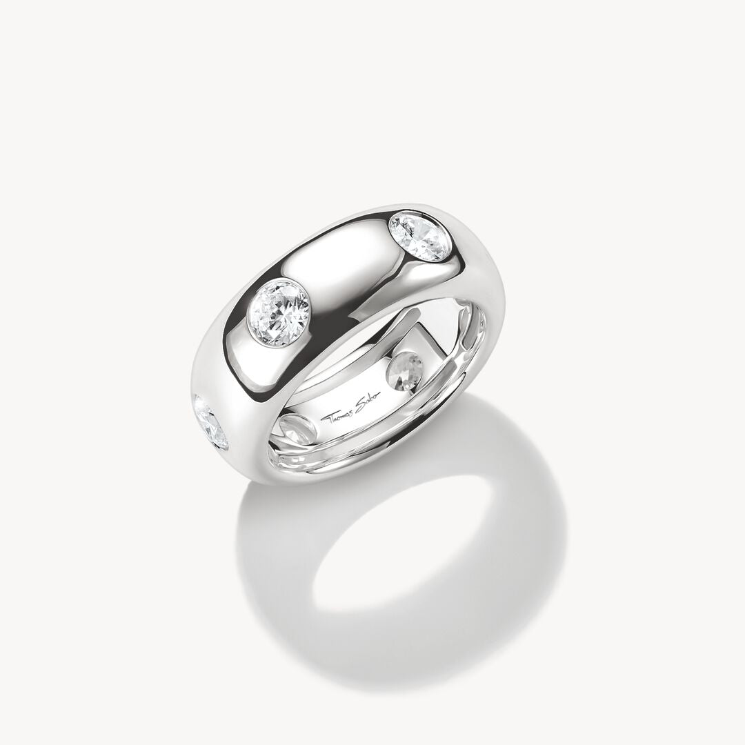 Silver ring with embedded diamonds on a white background