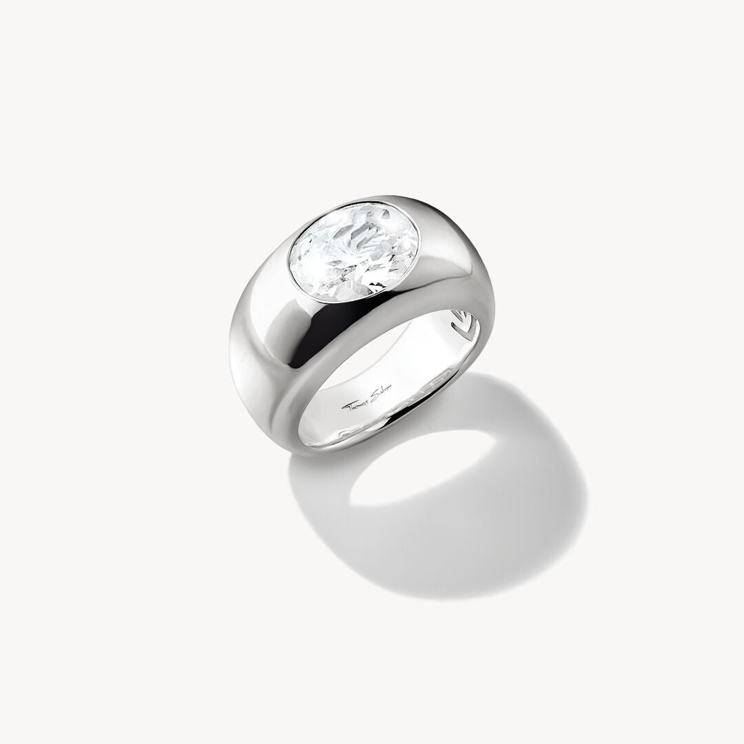 Silver ring with a clear gemstone on a white background