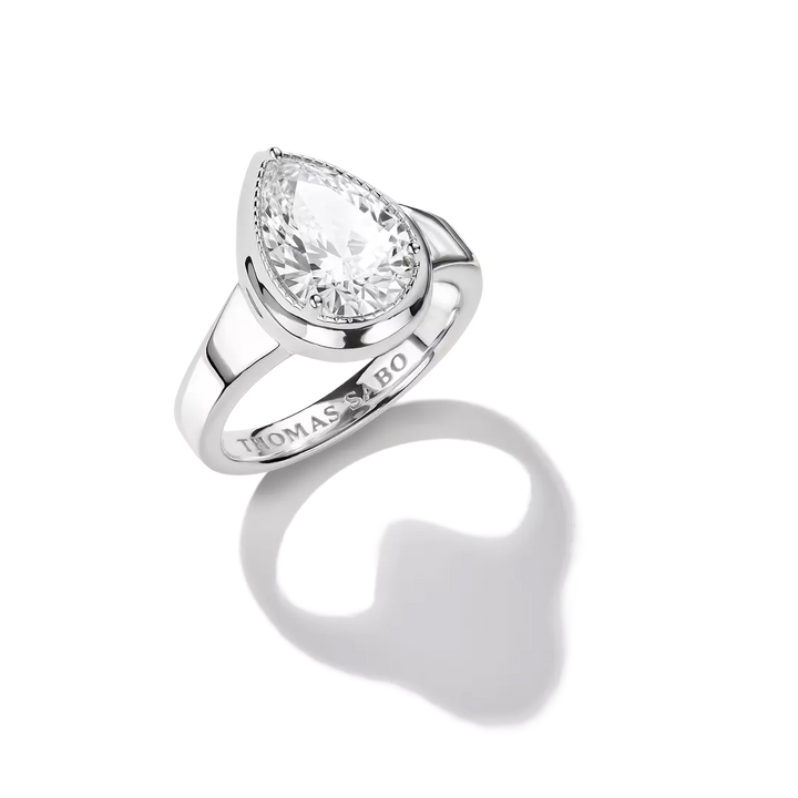 A silver-toned pear-cut diamond ring by Thomas Bo, shown on a clean white background with a soft shadow beneath it.