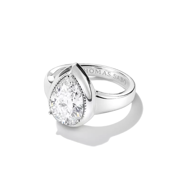 A Thomas Sabo pear-cut diamond ring in a polished silver-tone setting, shown on a clean white background with a soft shadow.