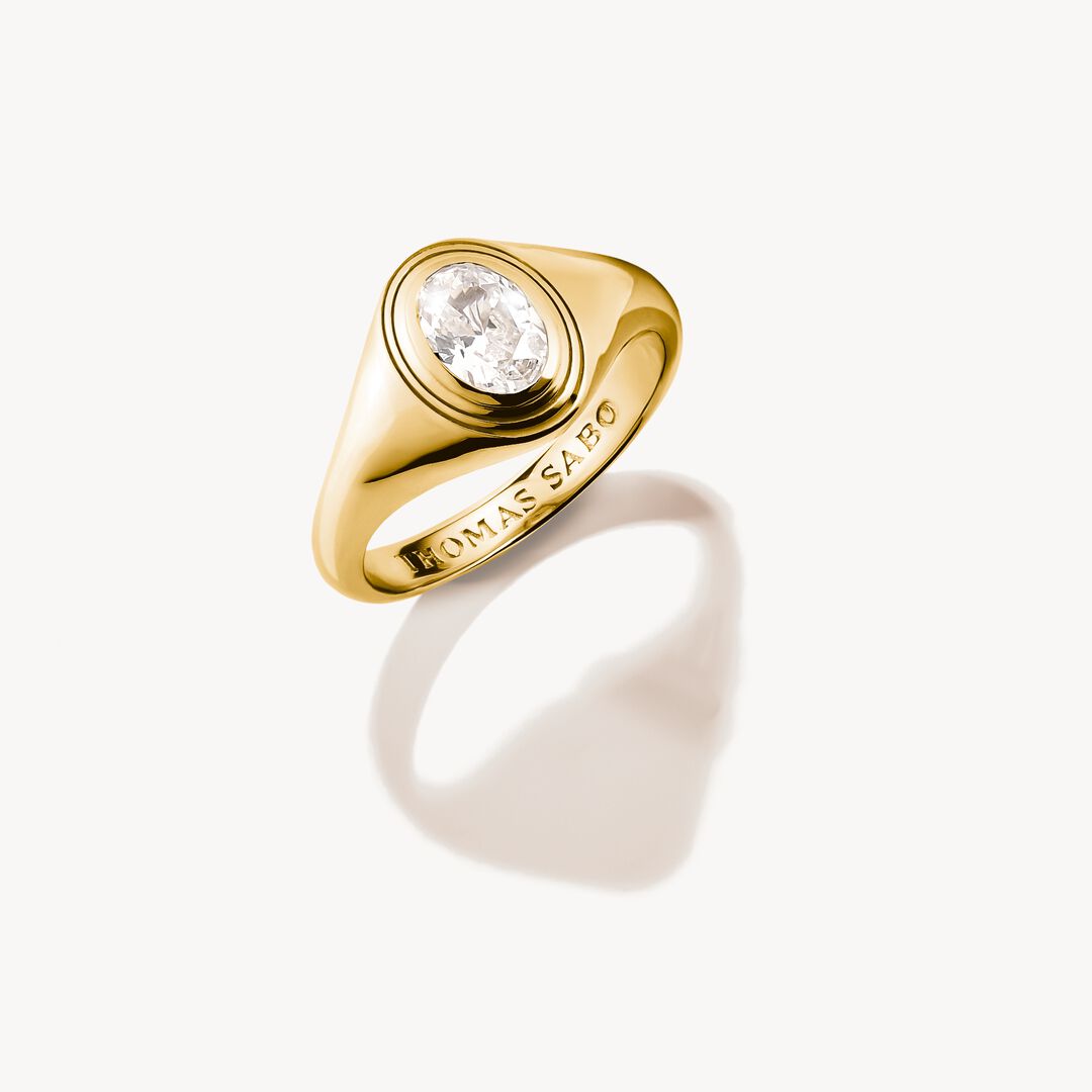 Gold ring with a diamond on a white background, featuring the brand 'Thomas Sabo'.