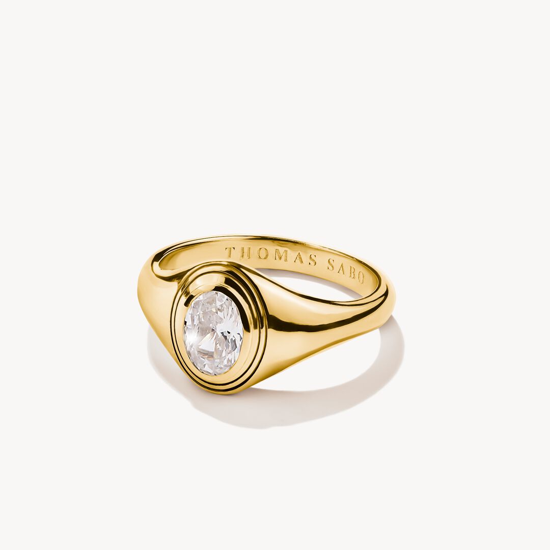 Gold ring with a diamond on a white background, featuring the brand 'Thomas Sabo'.