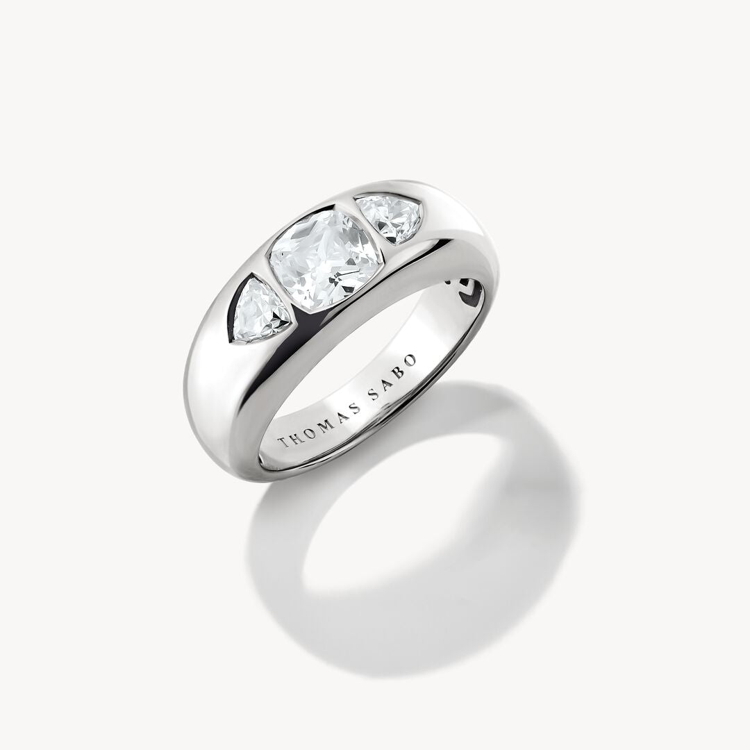 Silver ring with three clear gemstones on a white background, featuring the Thomas Sabo brand.