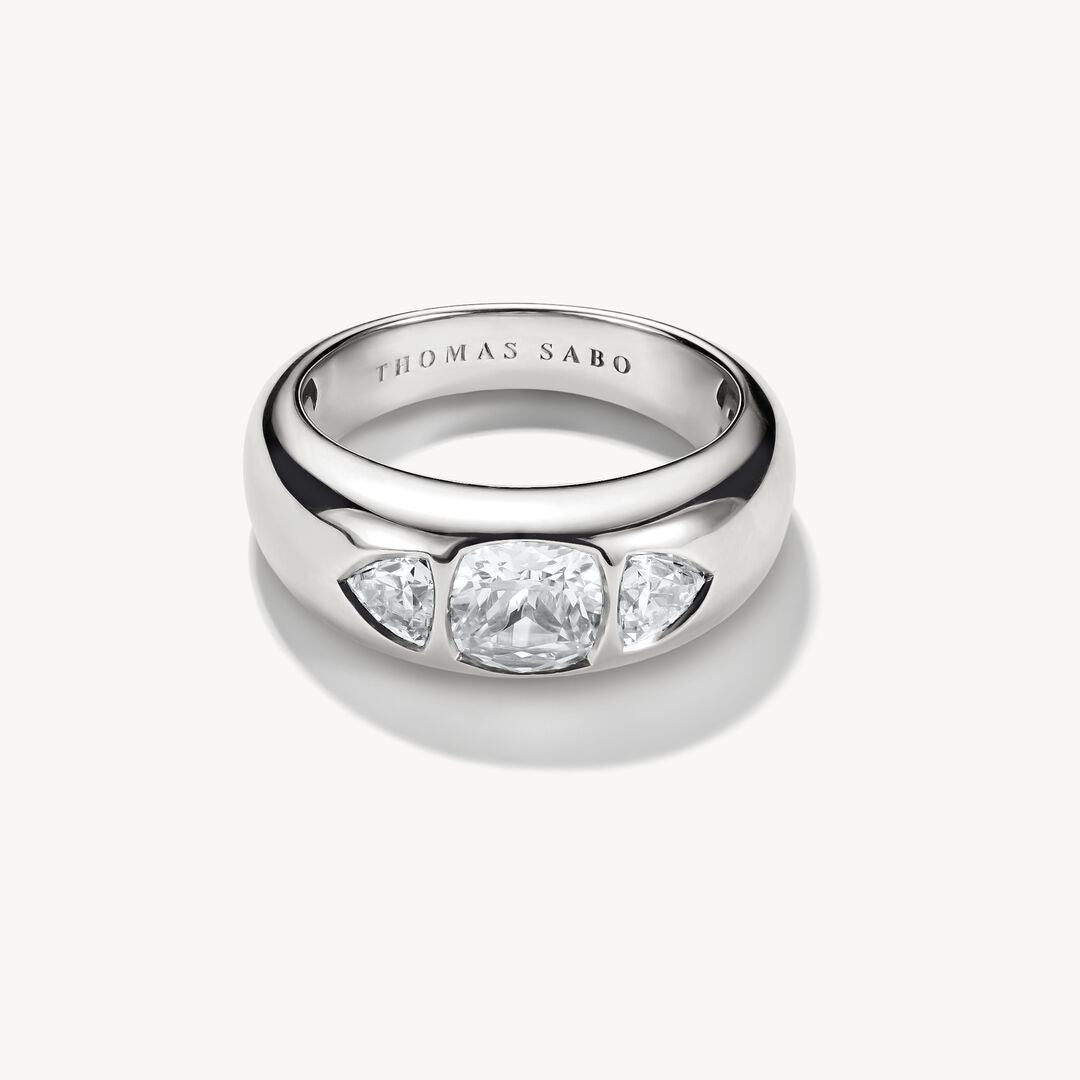 Silver ring with three clear gemstones on a white background, featuring the Thomas Sabo brand.