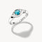 Silver ring with a turquoise gemstone on a white background