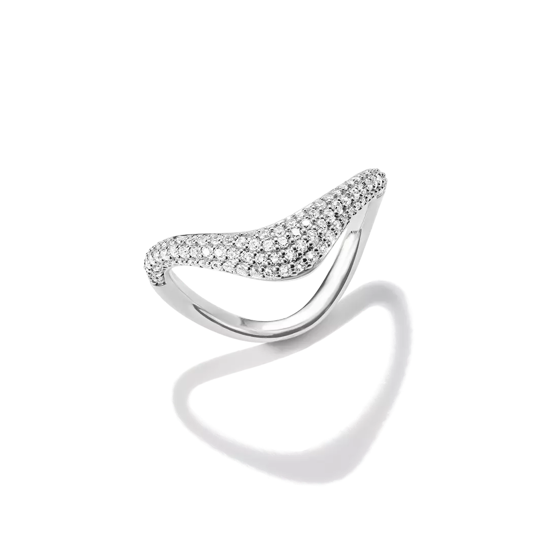 A silver-toned curved ring featuring a pavé-set row of clear stones across the top, photographed on a clean white background with a soft shadow beneath.