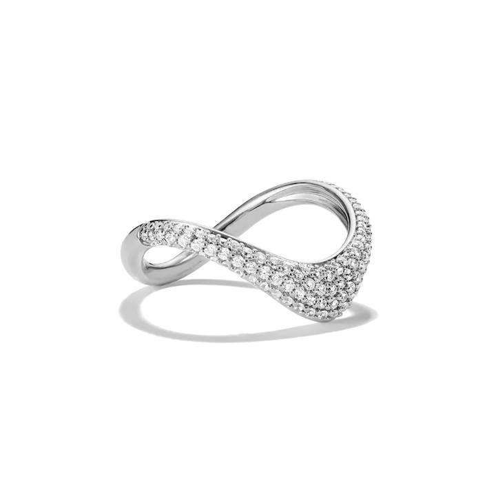 An infinity-shaped silver ring paved with small clear stones, shown on a clean white background with a soft shadow.
