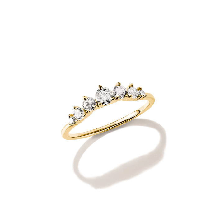 A yellow gold ring featuring five marquise-cut clear gemstones set in a row, shown on a clean white background with a soft shadow.