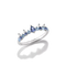A silver-tone ring featuring a row of light blue and deep blue gemstones, including a central marquise-cut blue stone, set against a clean white background with a soft reflection.