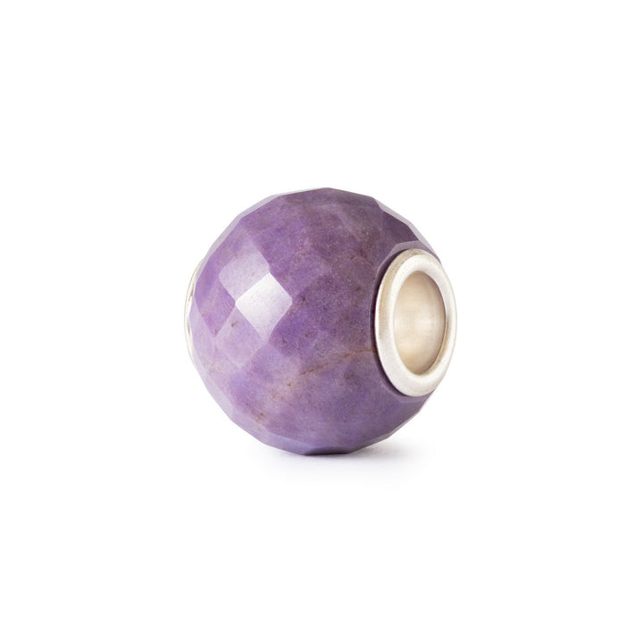 Purple bead with silver accent on a white background