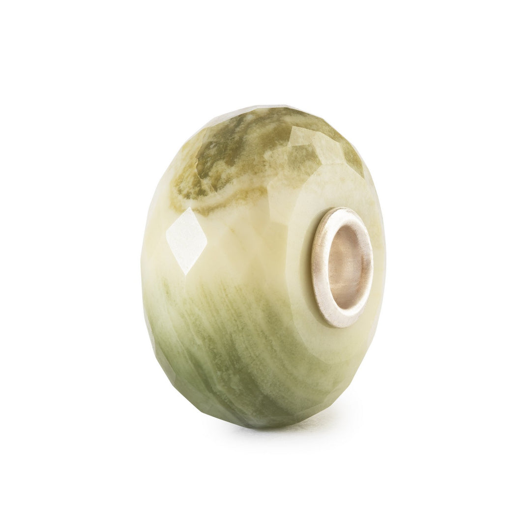Green stone bead on a white background