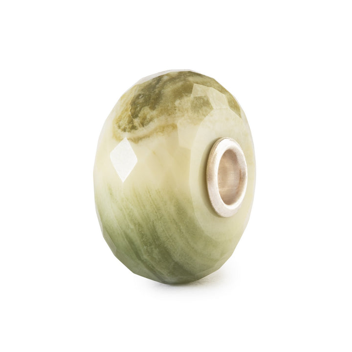 Green stone bead on a white background