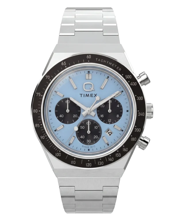 A Timex chronograph watch with a silver stainless steel case and link bracelet, featuring a light blue dial with black subdials and a black tachymeter bezel, shown against a plain white background.