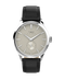 A Timex The Century watch with a silver stainless steel case, a cream-colored dial with vertical stripes, and a black leather strap, shown against a plain white background.