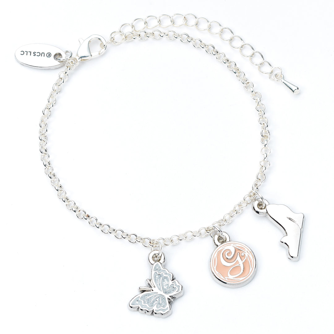 Silver bracelet with butterfly and circular charm on a white background