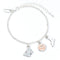 Silver bracelet with butterfly and circular charm on a white background