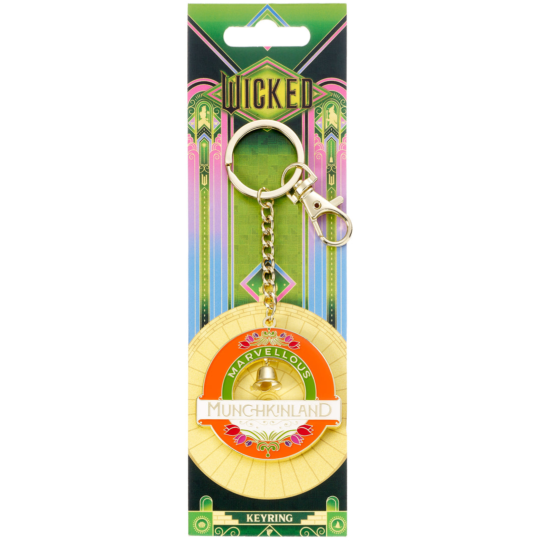Keychain with 'Wicked' branding on a colorful packaging background