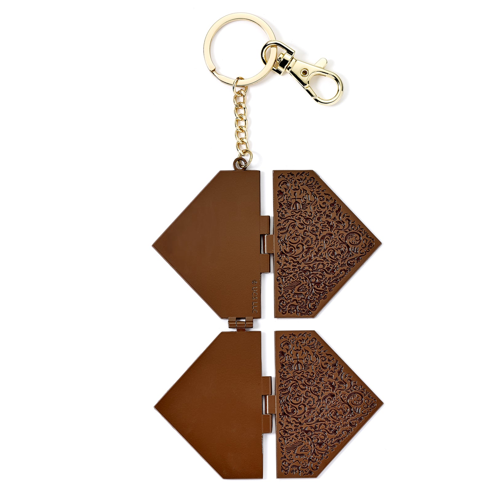 Brown geometric keychain with intricate patterns on a white background