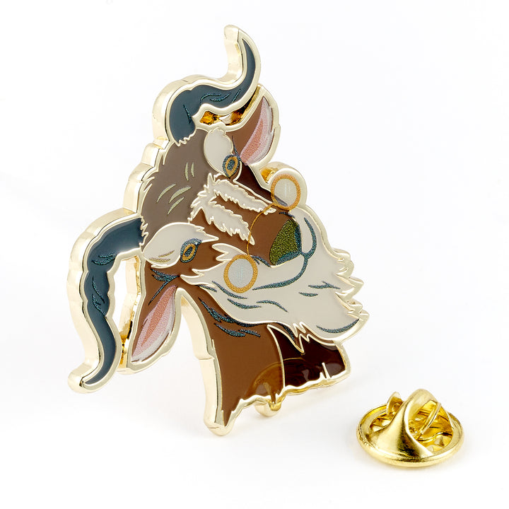 Enamel pin of a fantasy character with gold accents on a white background