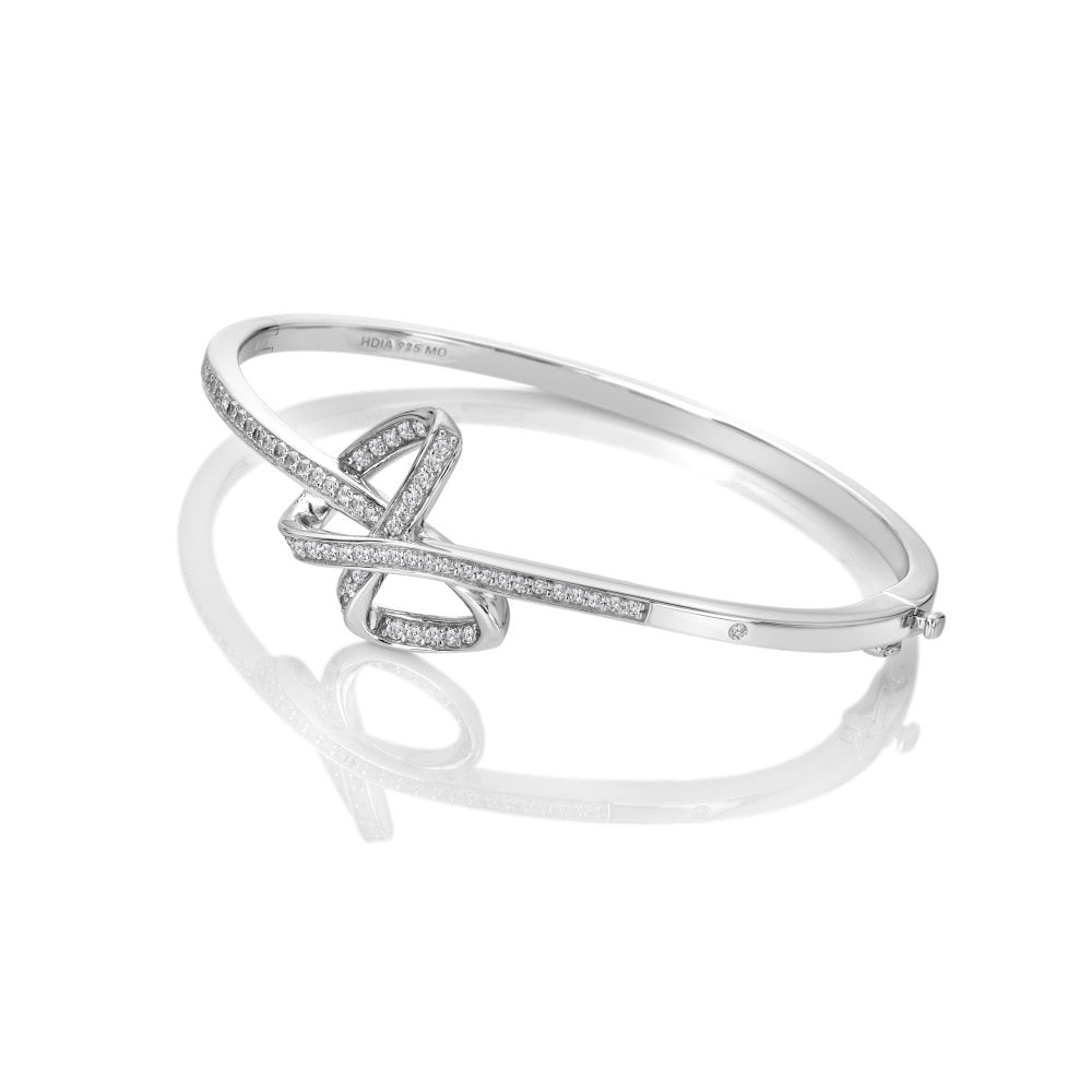 Silver bracelet with interlocking design on a white background