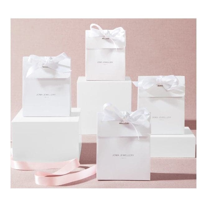 a group of white boxes with bows on them