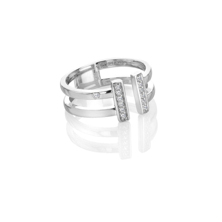 Silver ring with diamond accents on a white background