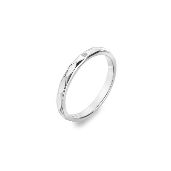 Silver ring with a small diamond on a white background