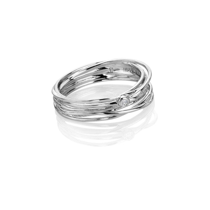 Stack of silver rings with a diamond on a white background