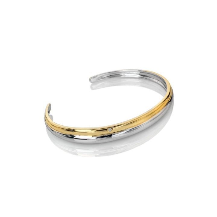 Two-toned silver and gold bracelet on a white background
