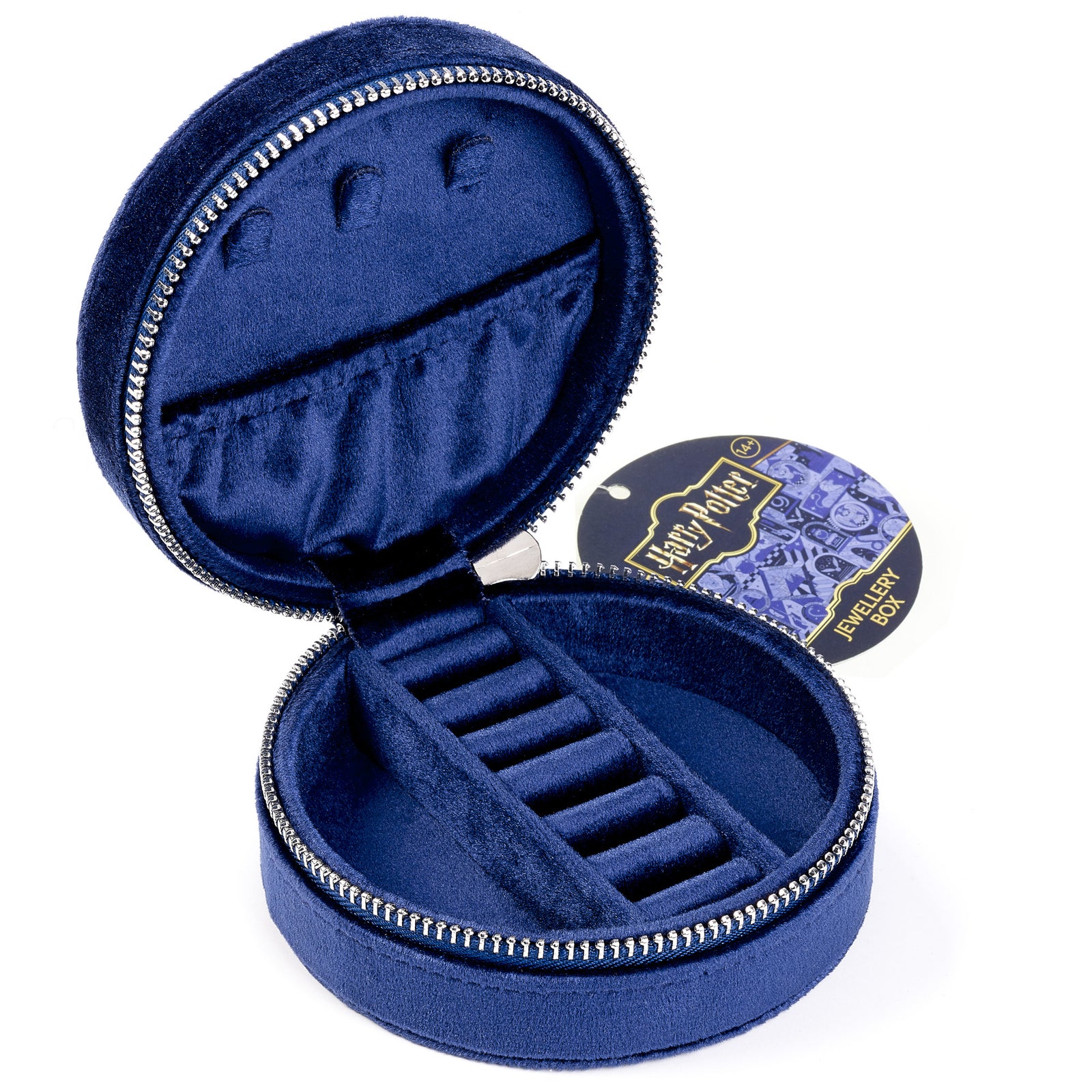 Open blue velvet jewelry box with a small round pouch on a white background