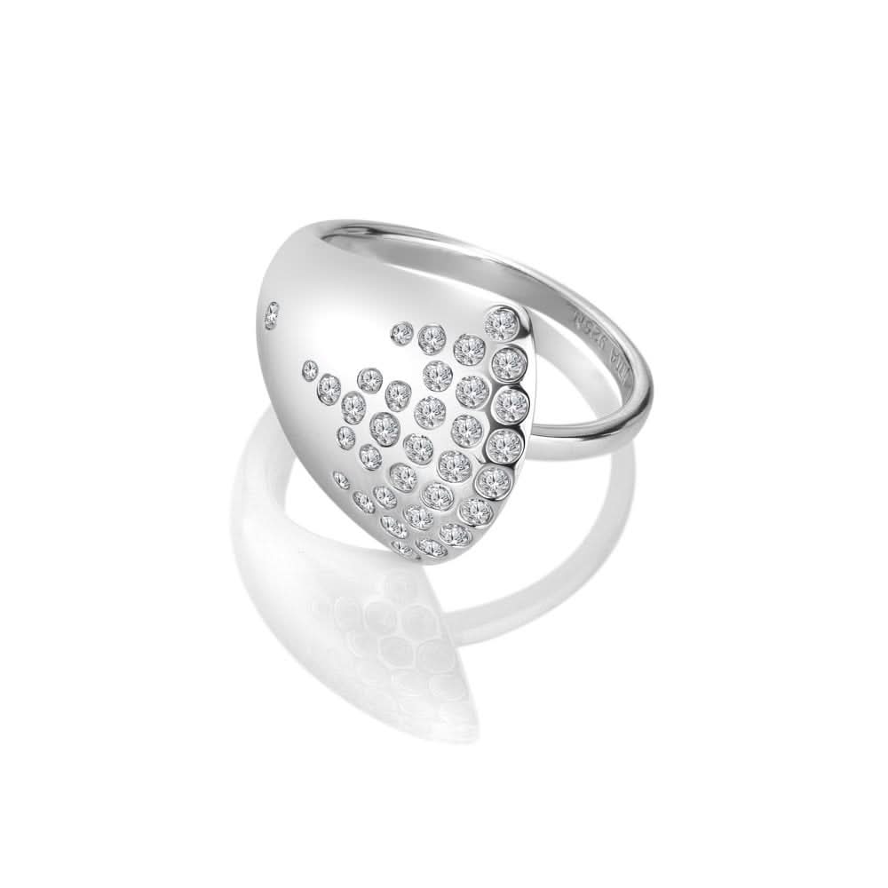 Elegant sterling silver ring adorned with sparkling white topaz stones, designed with sweeping curves, showcasing a luxurious and contemporary style.