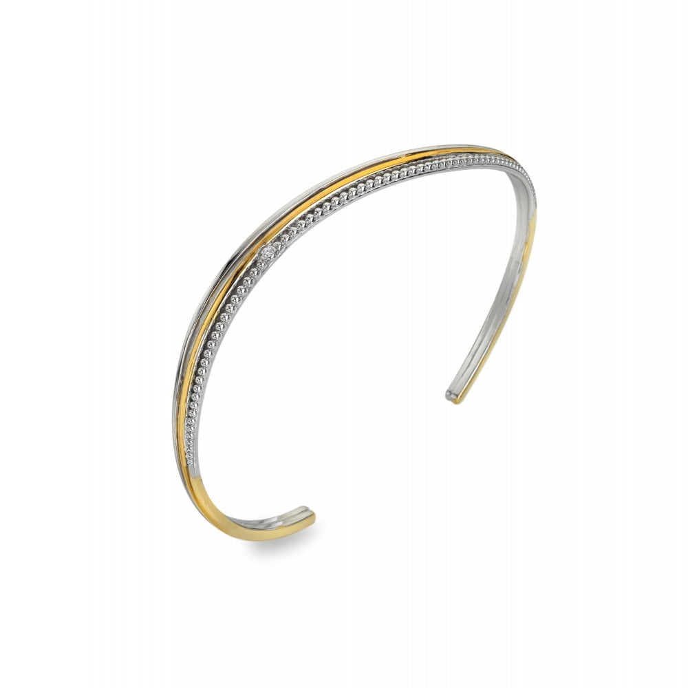 Two-tone gold and silver bangle on a white background