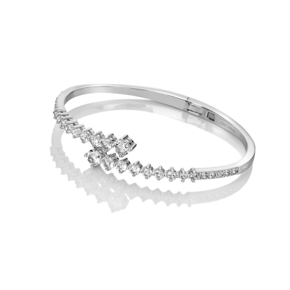 Silver bracelet with diamond accents on a white background
