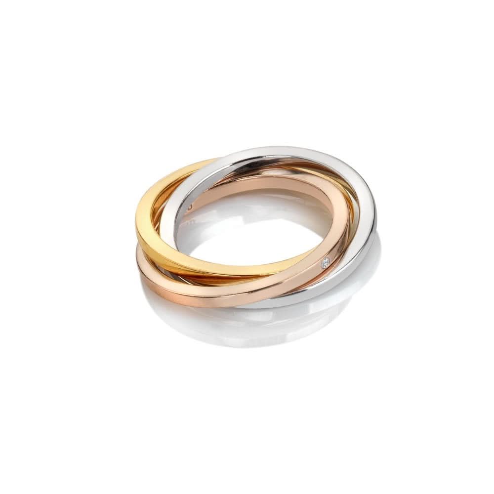 Sterling Silver Trio Tri-Colour Ring featuring interlocked hoops in silver, rose gold, and yellow gold finishes, elegantly displaying a hand-set diamond.
