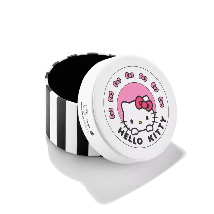 A round Hello Kitty branded container or box with a white lid featuring the Hello Kitty face, pink bow, and 'HELLO KITTY' text, next to a black-and-white striped cylindrical body, on a white background.