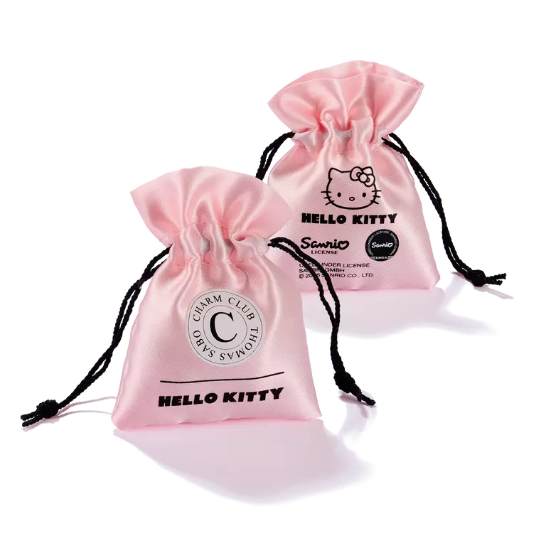 Two light pink satin drawstring pouches with black cords, each printed with Hello Kitty graphics and text, on a white background.