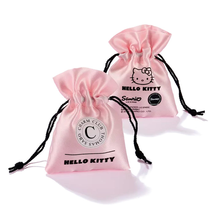 Two light pink satin drawstring pouches with black cords, each printed with Hello Kitty graphics and text, on a white background.