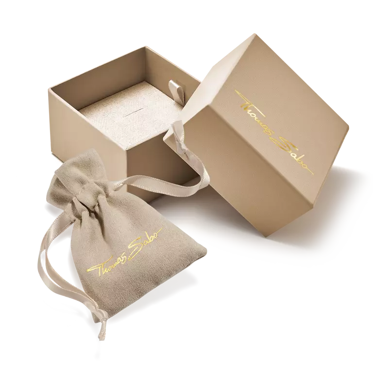 Open beige jewelry box with a matching drawstring bag featuring 'Thibault Sabot' branding on a white background.